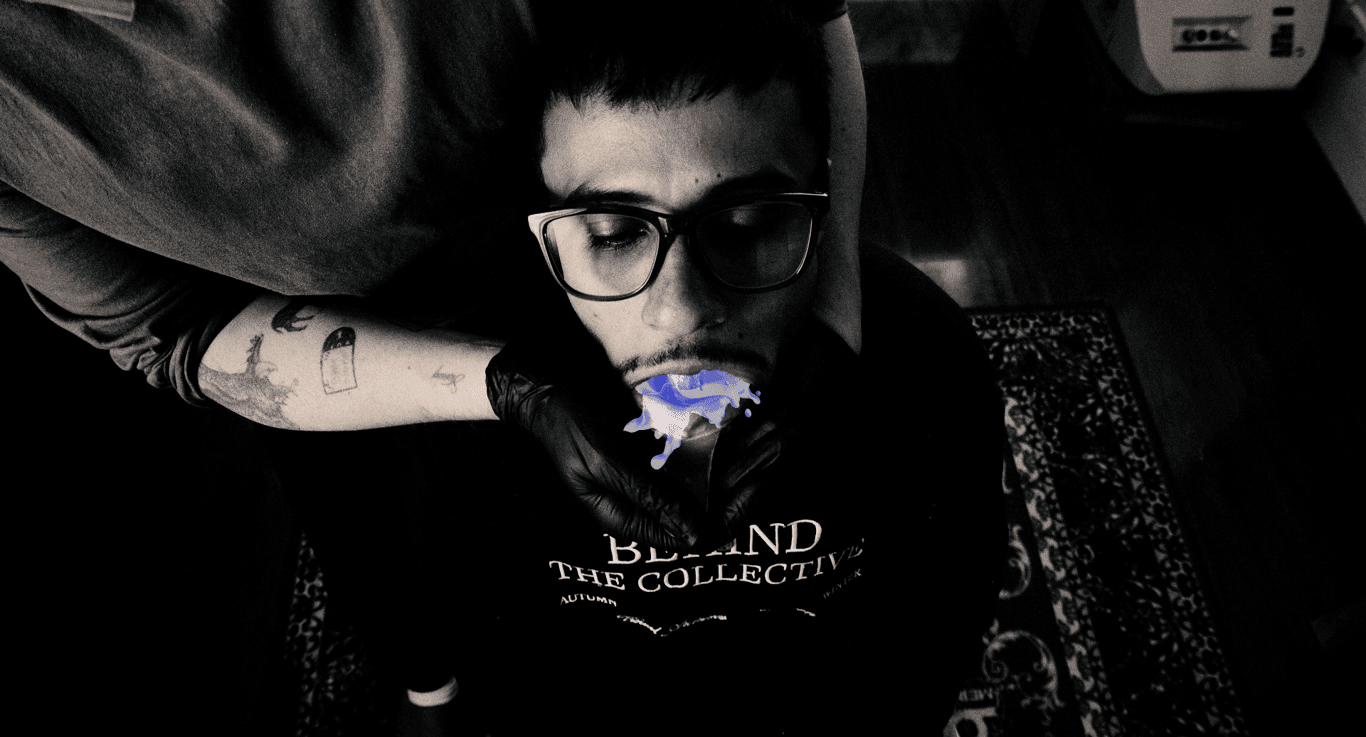 Contact Image | Guy with glasses getting a mold done for grillz